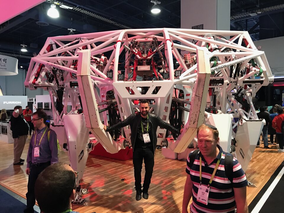Eric Matzner exploring future technology at an exhibition